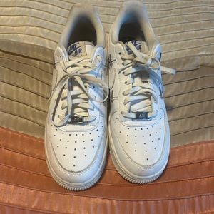 Women Nike Athletic Shoes.  Size 8. Color White.  Fairly Worn.